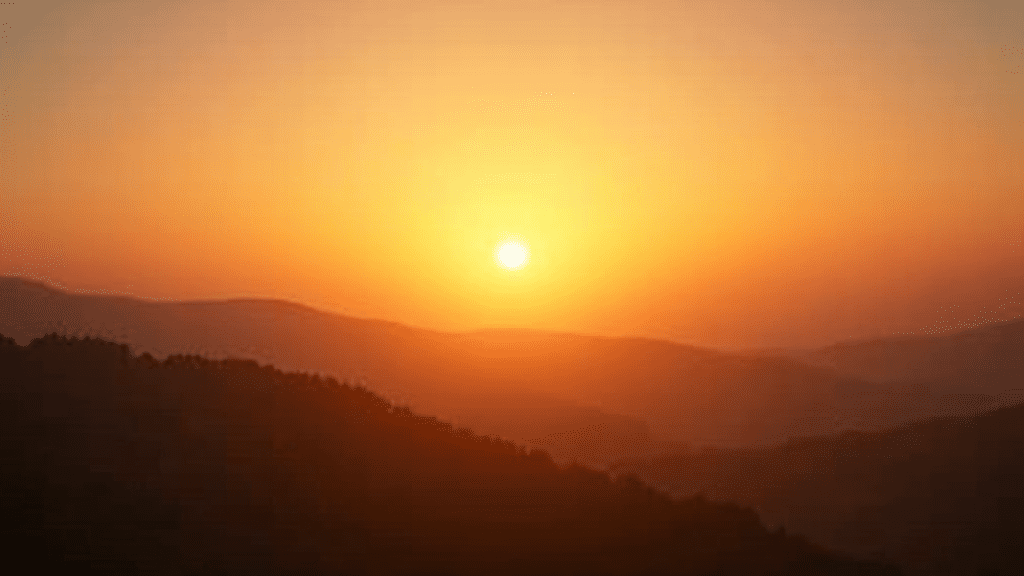 The Power Of Positive Thinking: Transform Your Emotional Wellbeing 2 Sunrise over peaceful landscape, symbolizing hope and positive change